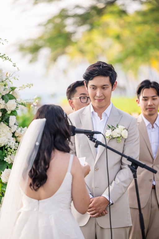 groom listening as the bride delivers her vows