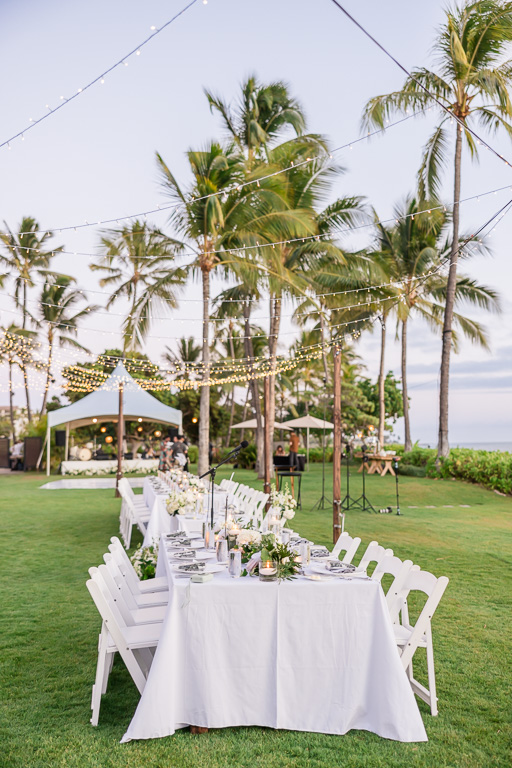 long reception table with string lights at Four Seasons Oahu