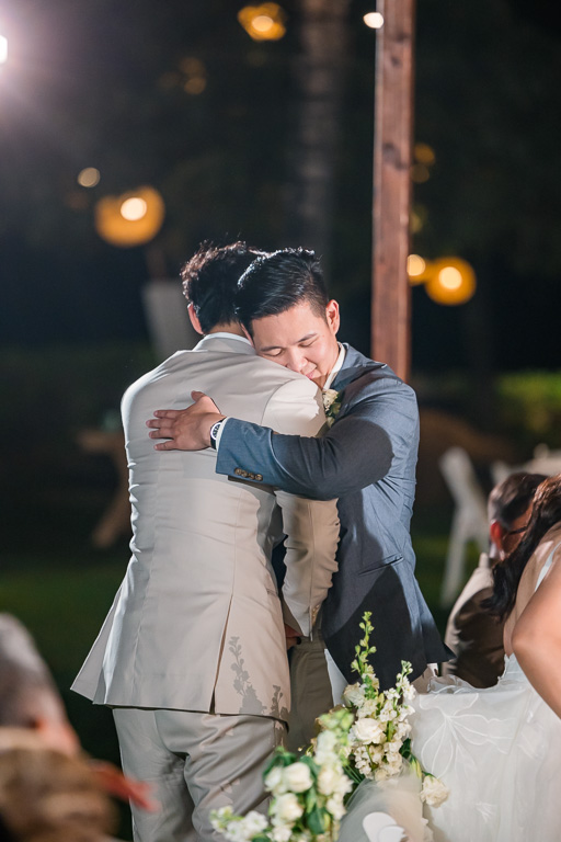 groom and brother hugging