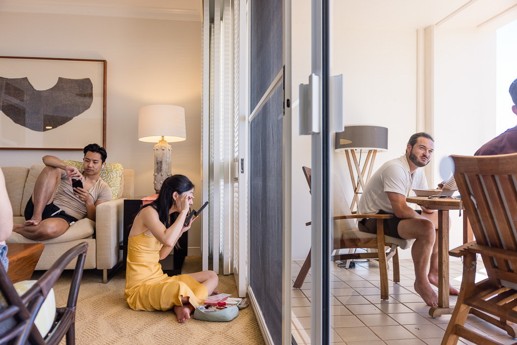 some wedding guests getting ready for the wedding in a hotel room