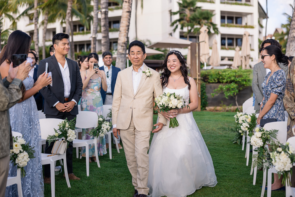 bride walking down the aisle with her dad