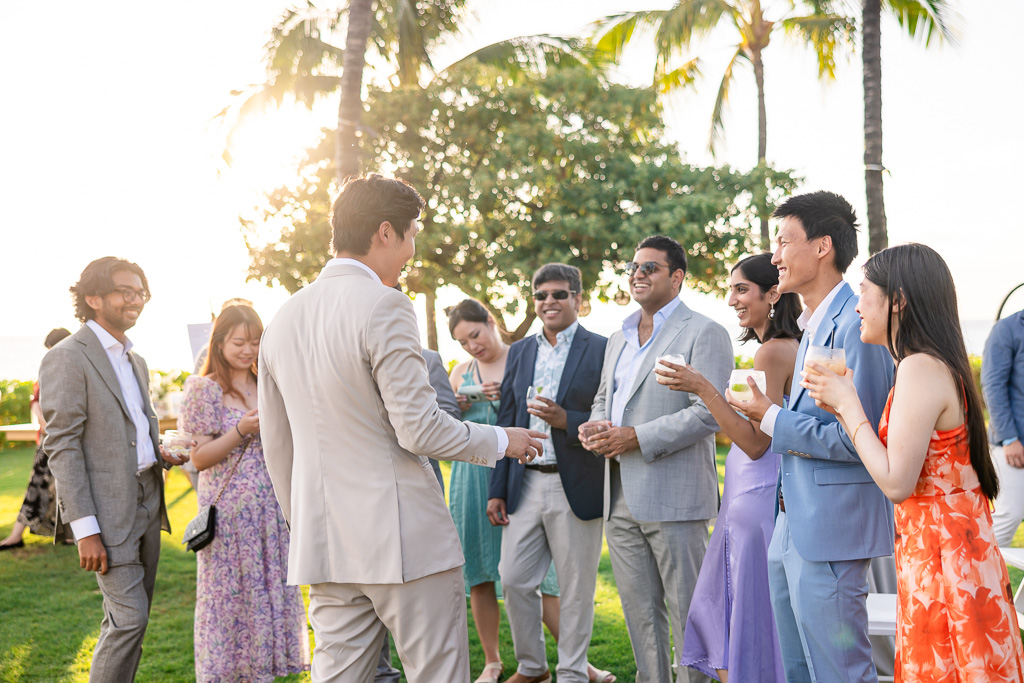 guests congratulating the groom during cocktail hour