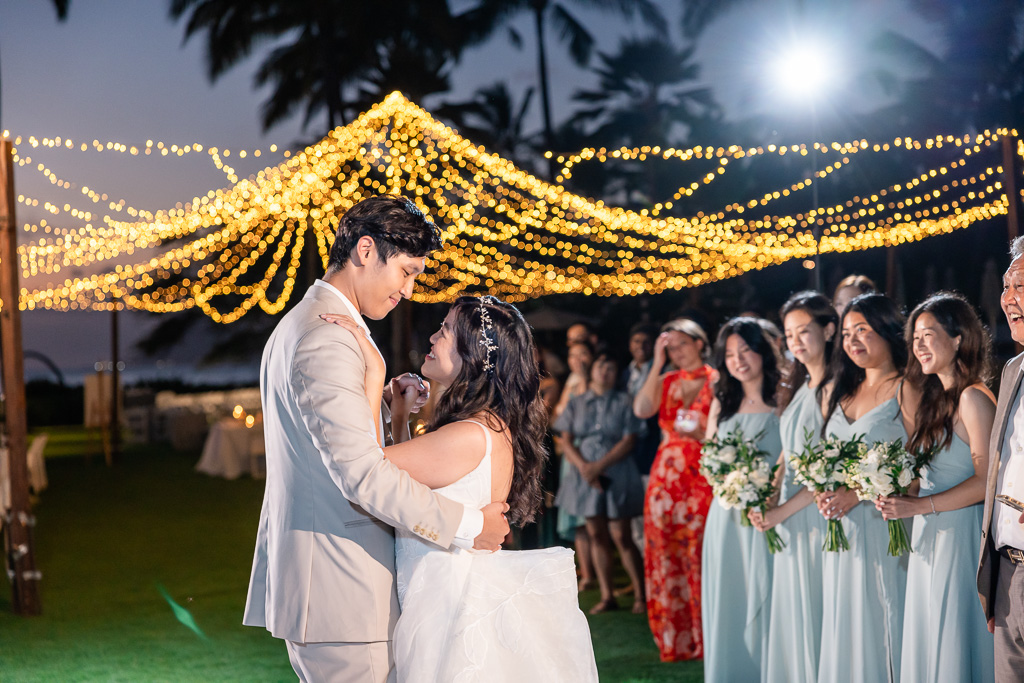 outdoor first dance with pretty string lights in the background