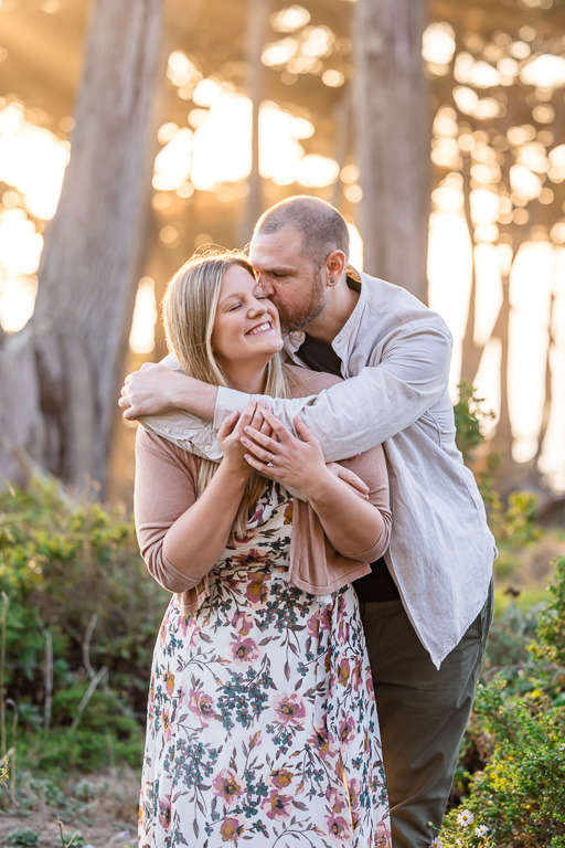 San Francisco engagement photo shoot in the woods with golden light spilling out