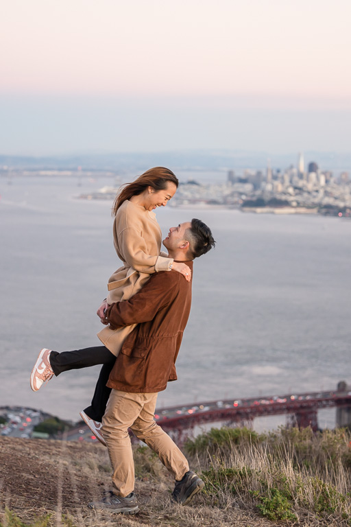 engagement photos above the San Francisco skyline