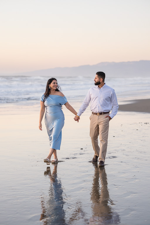 blue hour engagement photos of couple on the beach