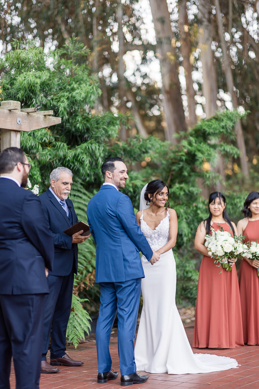 bride laughing during a funny moment of the ceremony