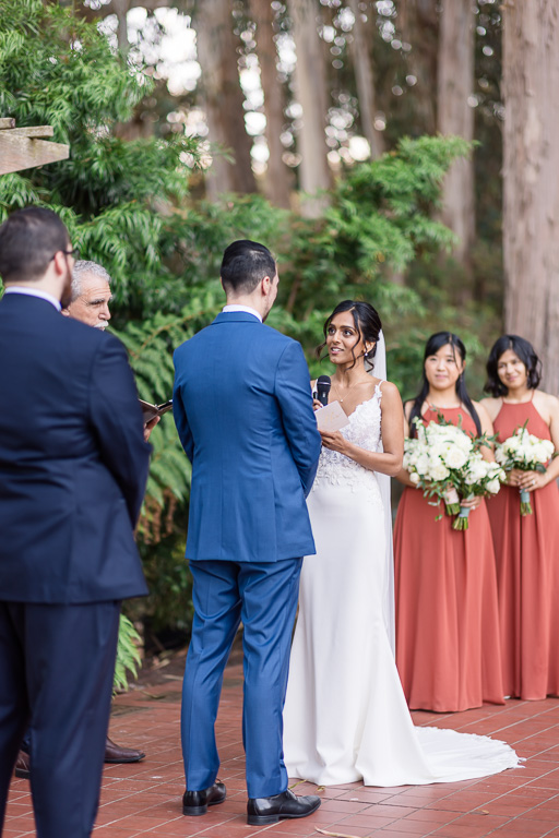 bride delivering heartfelt vows at their wedding at Golden Gate Club in the garden outside