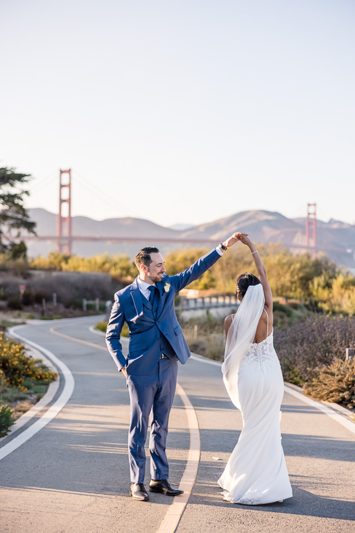 candid documentary-style wedding photo of bride and groom at the Golden Gate Bridge