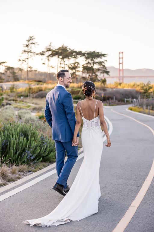 newlyweds walking into the sunset