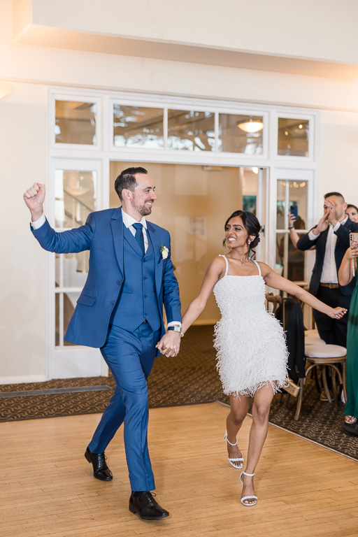 bride and groom's grand entrance to reception hall at Golden Gate Club