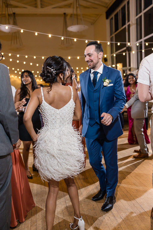 bride and groom sharing a candid moment on the dance floor