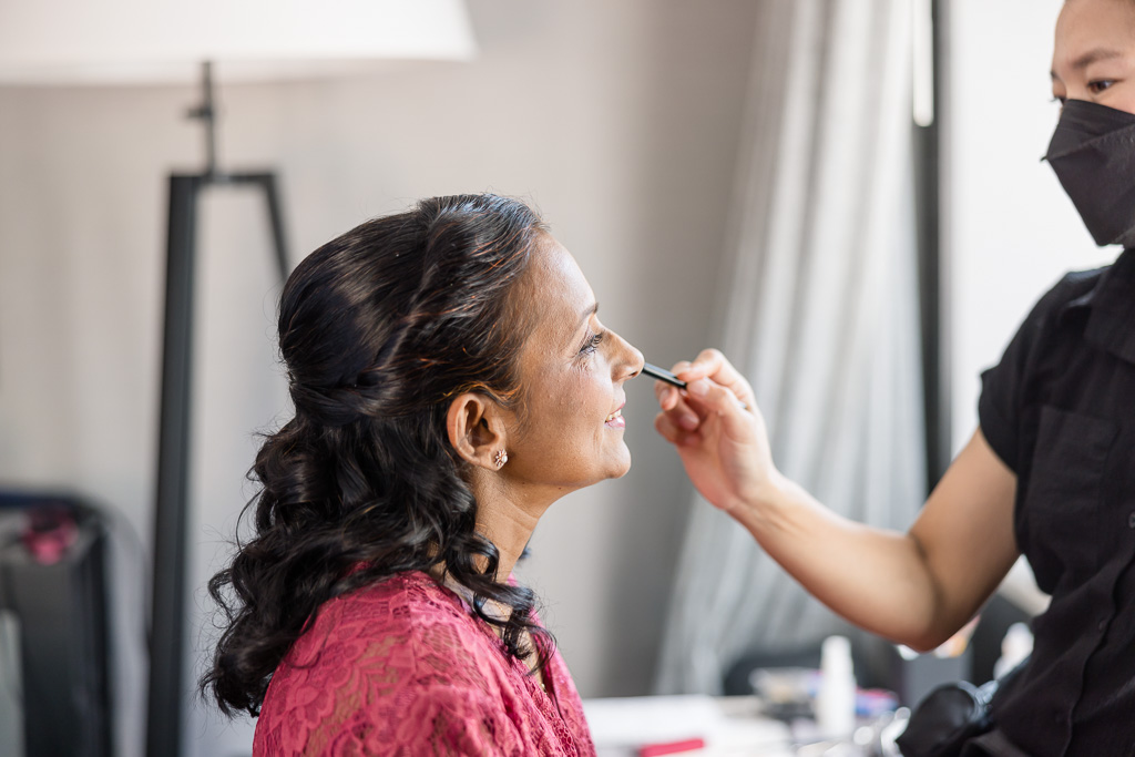 mother of the bride getting makeup done by Dreamcatcher Artistry