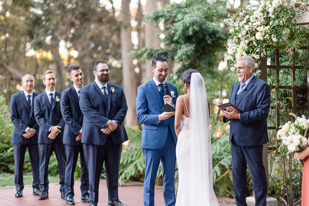 groom saying his wedding vows at their wedding ceremony in Golden Gate Club