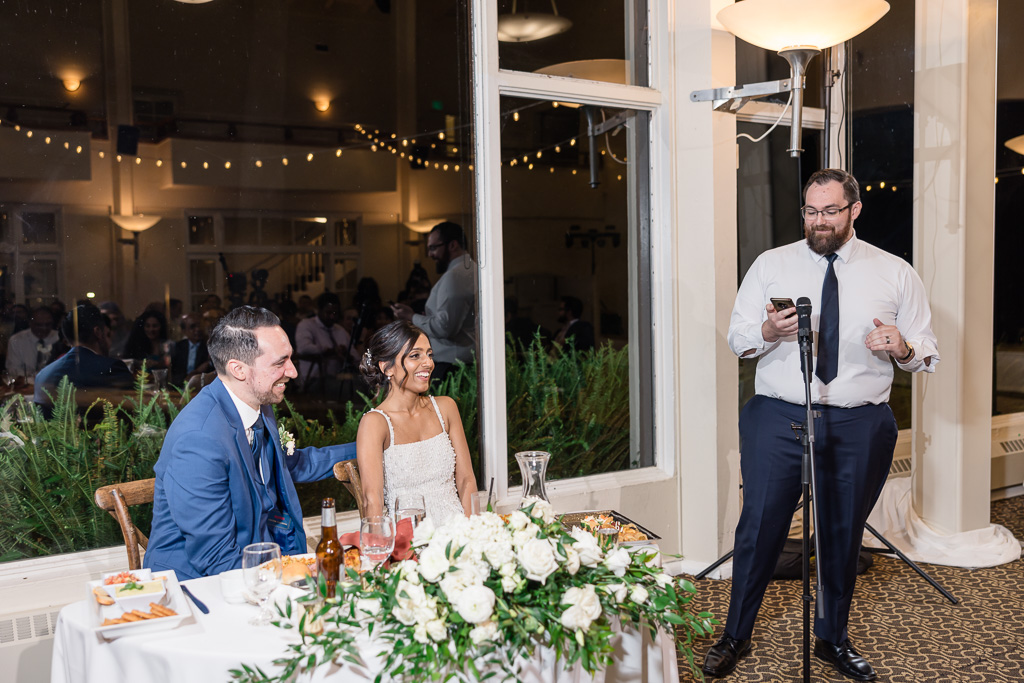 brother of the groom giving a speech at dinner