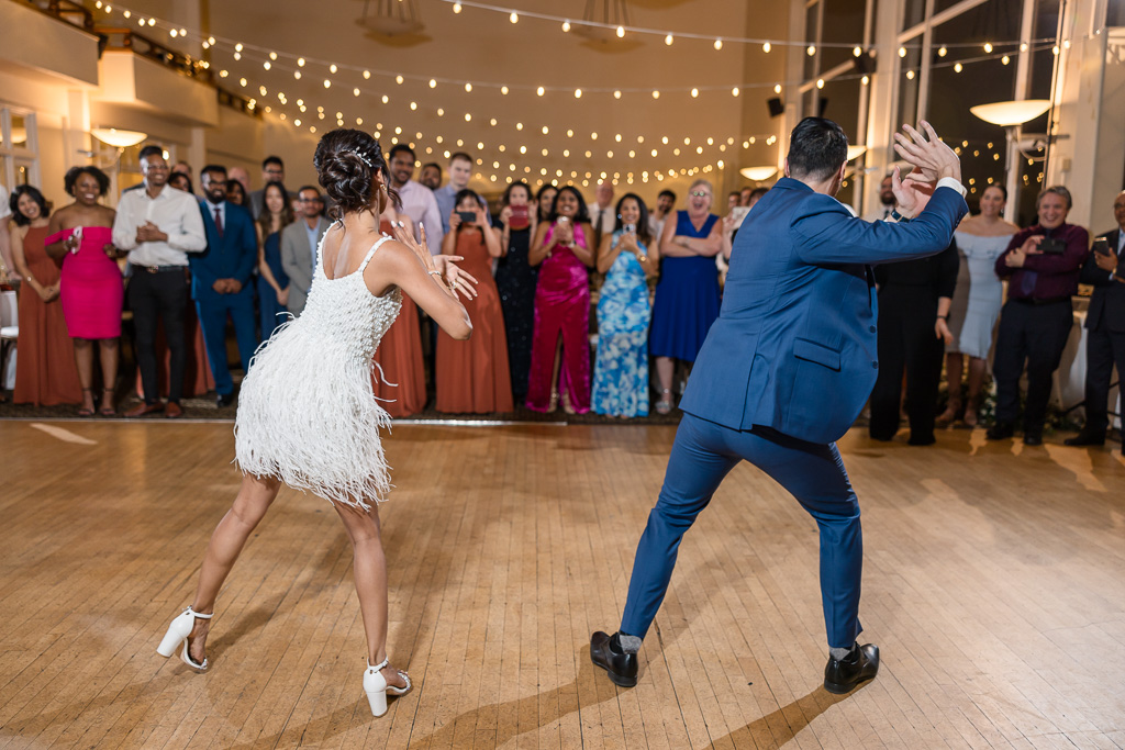 perfectly choreographed first dance by the bride and groom while guests look on