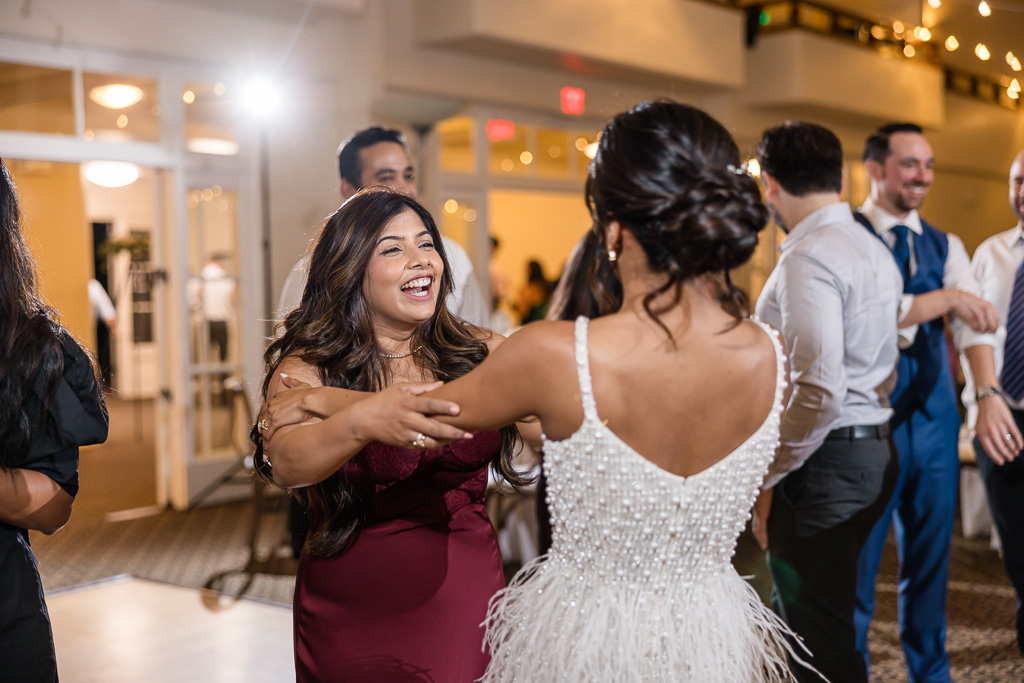 bride dancing with her friend