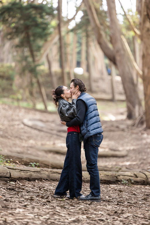 couple kissing in the woods