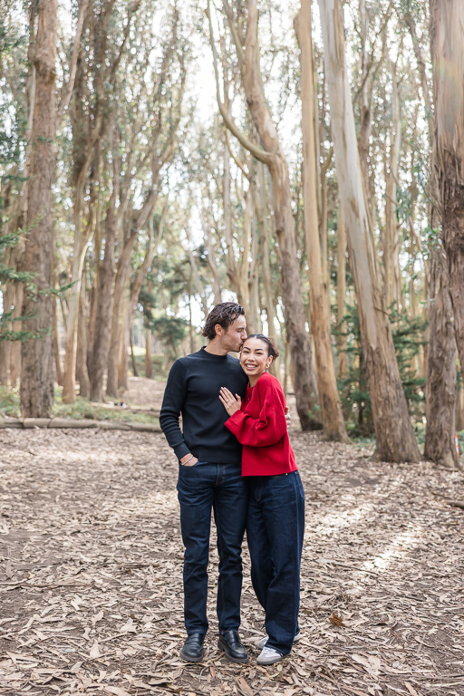 engagement photos at wood line tree tunnel