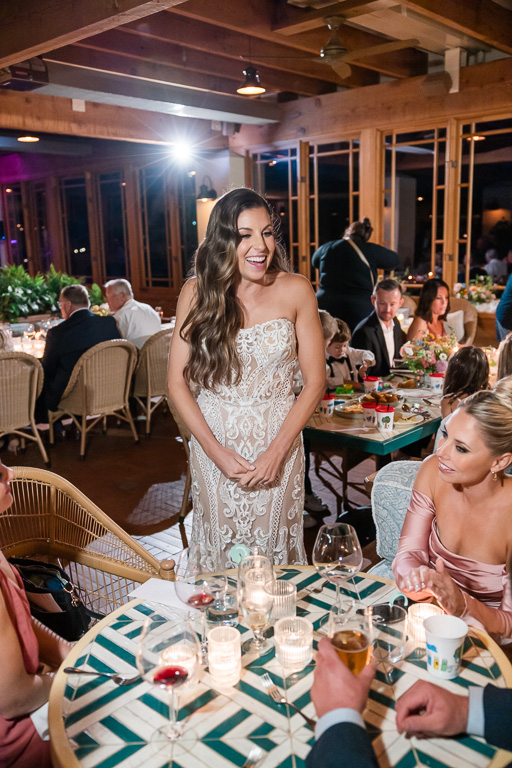 bride visiting a table of her friends