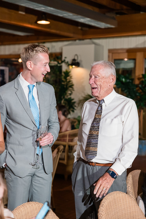 groom chatting with an older guest