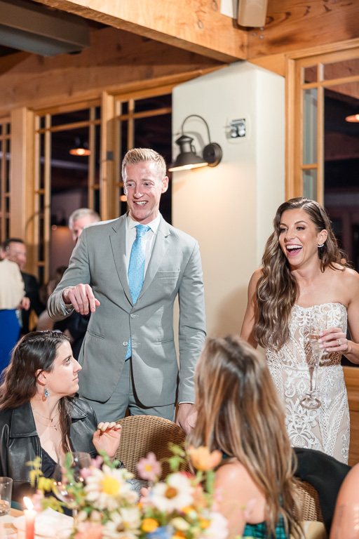 bride and groom visiting guests at tables