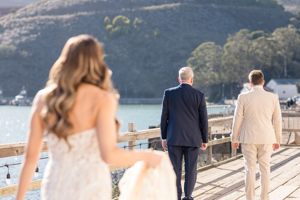 dad and brother first look with bride