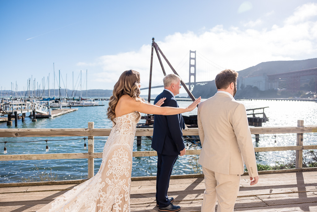 bride first look with dad and brother