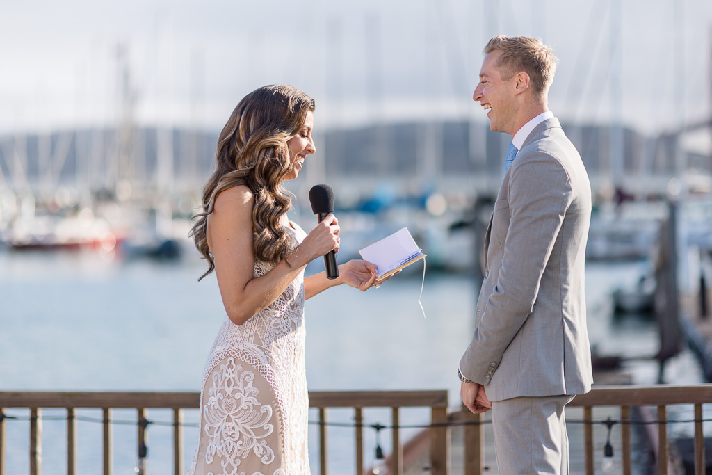 bride giving her vows at marina