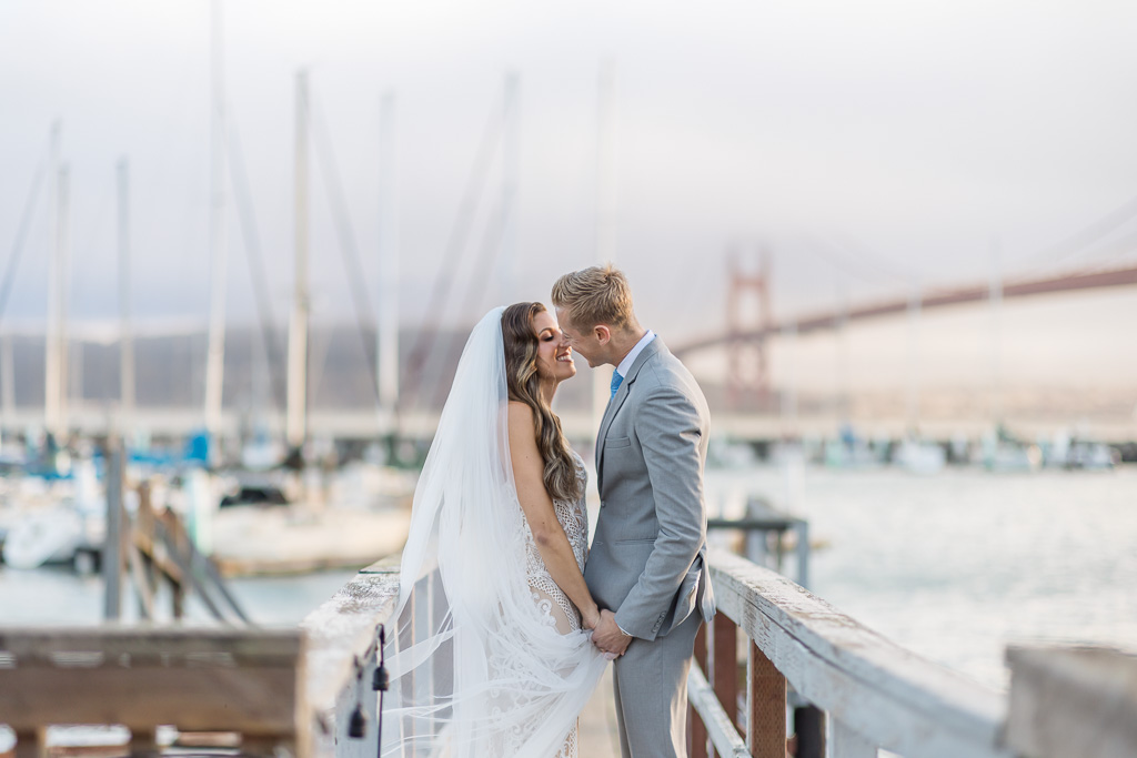 sunset wedding portrait at Travis Marina showing the Golden Gate Bridge