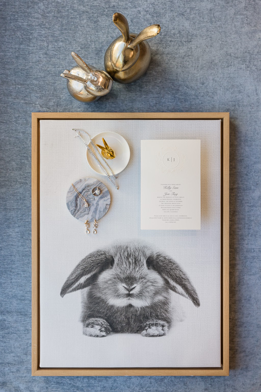 wedding rings and jewelry on a bunny canvas