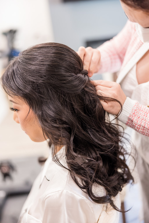 bride getting hair done