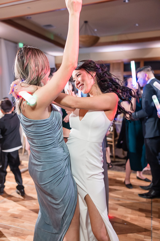 bride and bridesmaid dancing