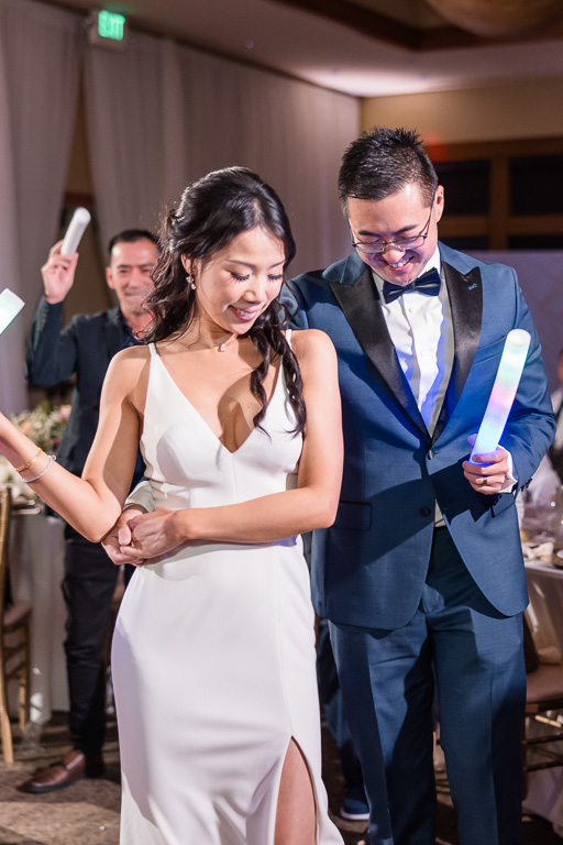 bride and groom in the middle of the dance floor