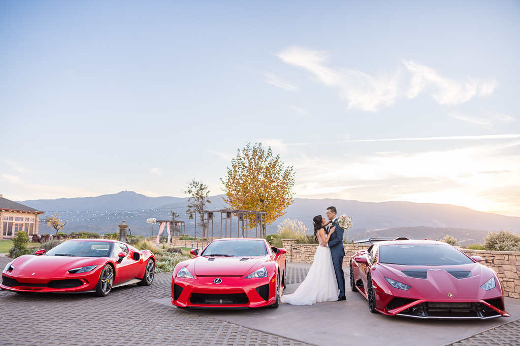 red Lamborghini, Lexus LFA, and Ferrari supercars parked in front of wedding at Boulder Ridge San Jose