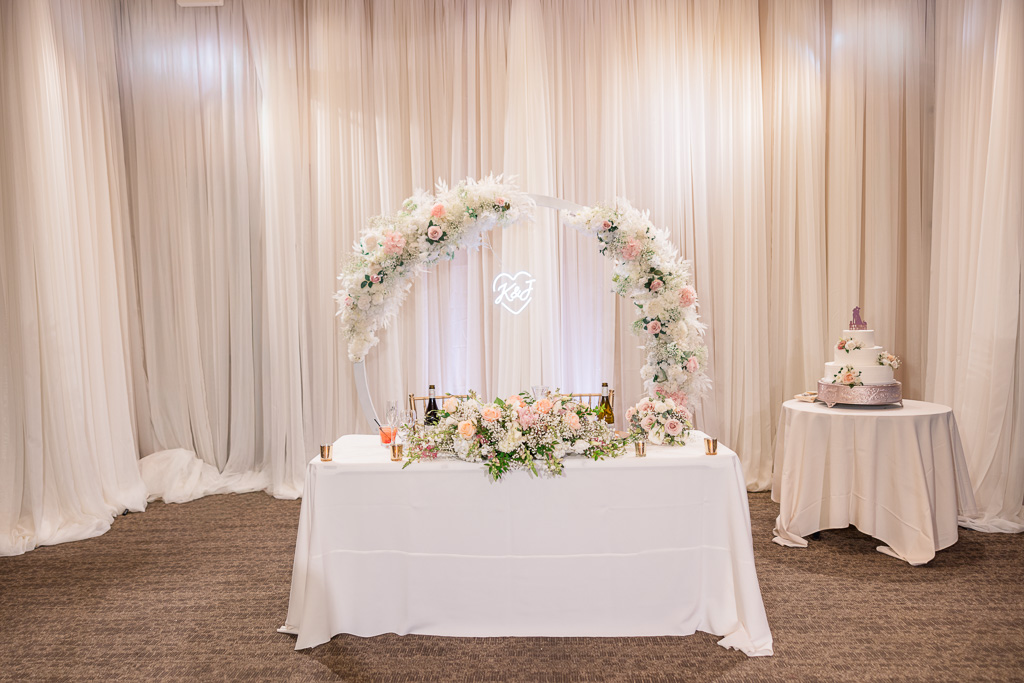 sweetheart table and cake at the reception hall at Boulder Ridge by Wedgewood Weddings