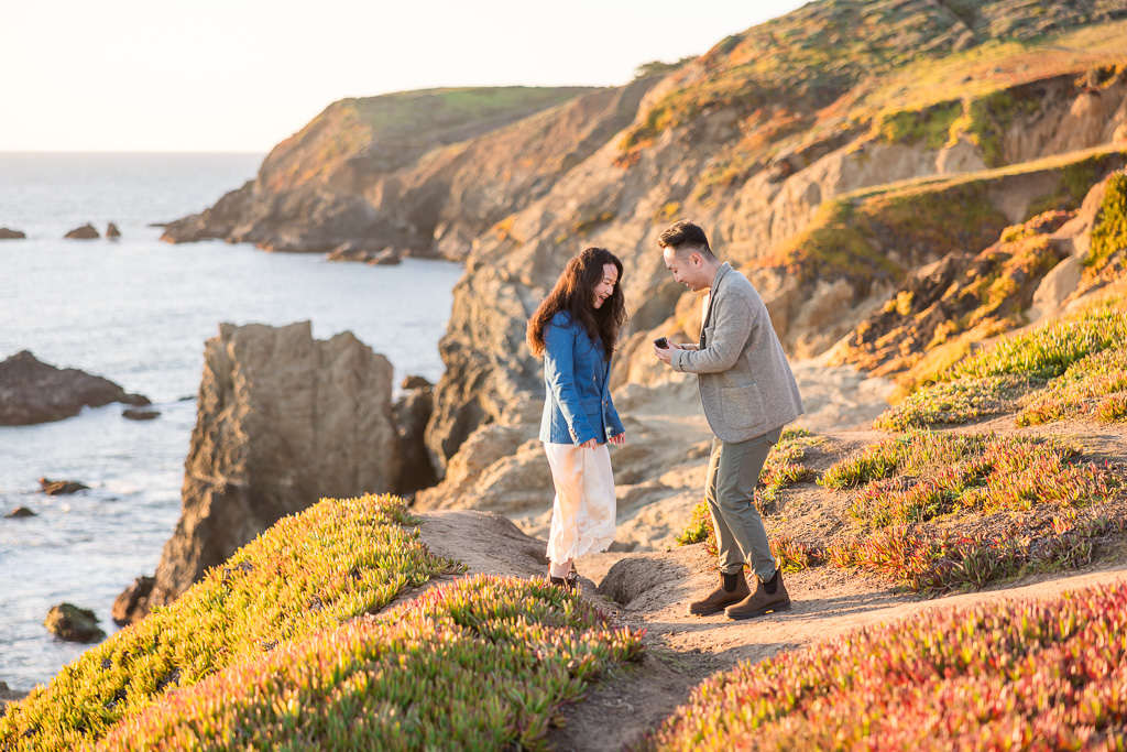 getting down on one knee to propose along the California coastline