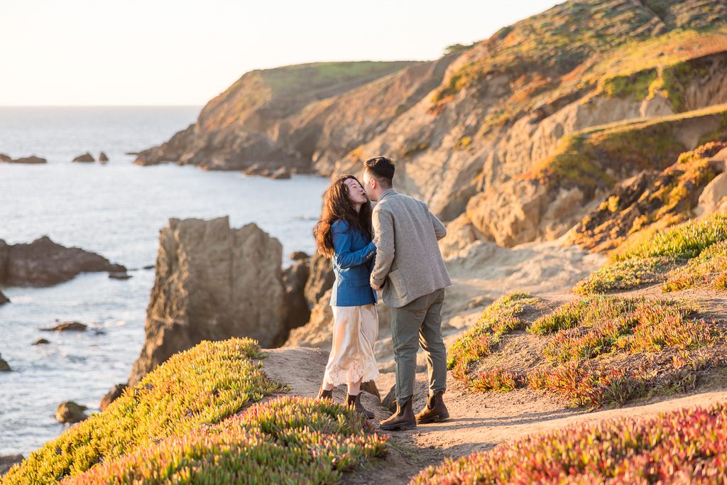 a kiss over the ocean cliffs