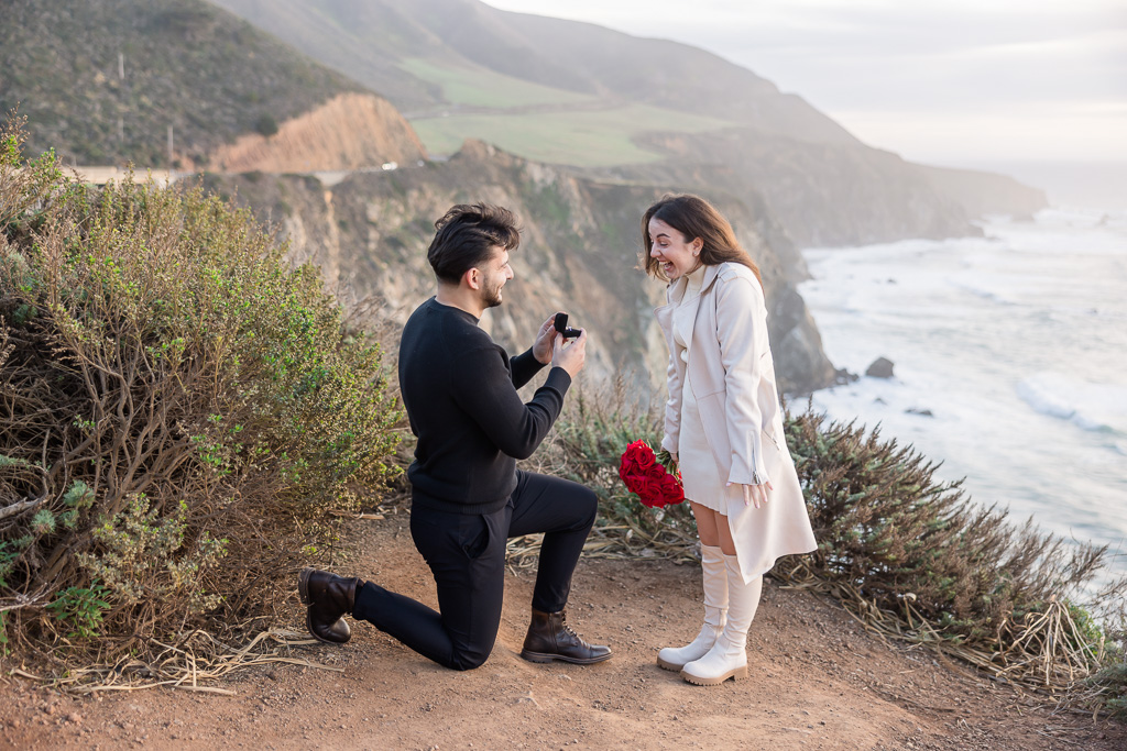 Big Sur cliffside surprise proposal with very surprised reaction