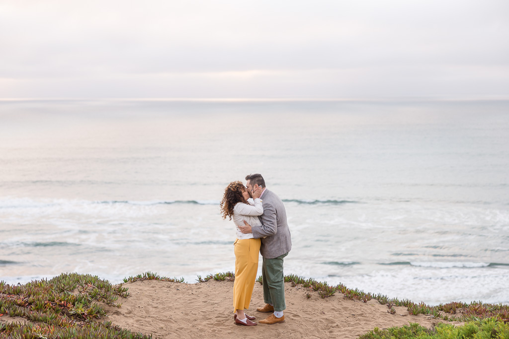 couple kissing at the edge of the world