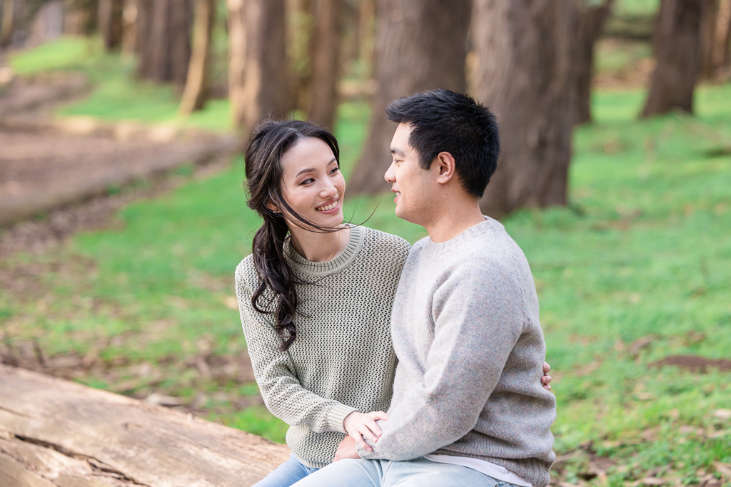 couple sitting on a log