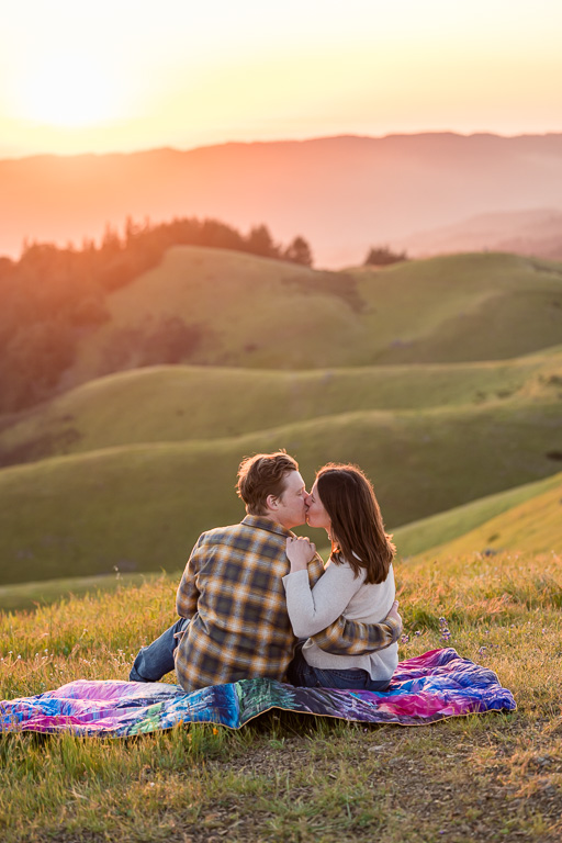 Mt Tam engagement photos on a picnic blanket with golden hour sunlight