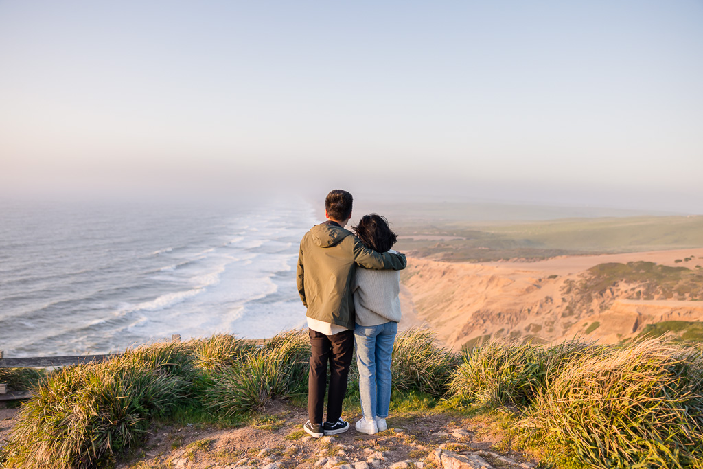 couple looking off over the cliffs of Point Reyes