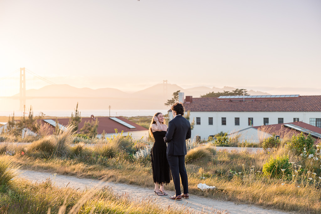 couple standing under the golden hour light in the Presidio