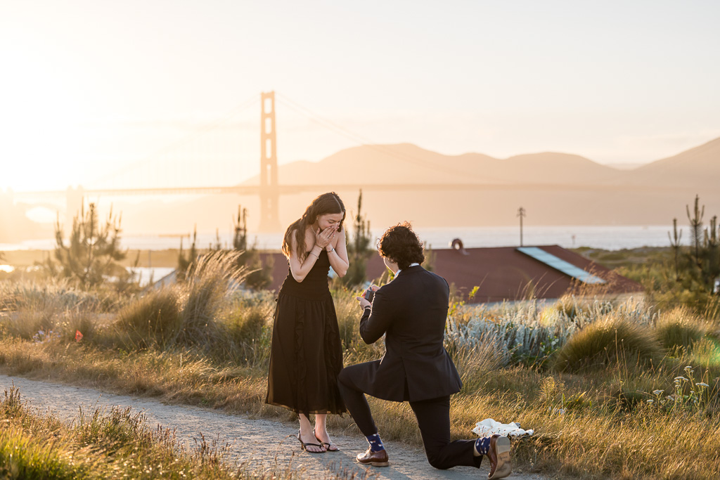 Presidio overlook surprise proposal at sunset near the Golden Gate Bridge