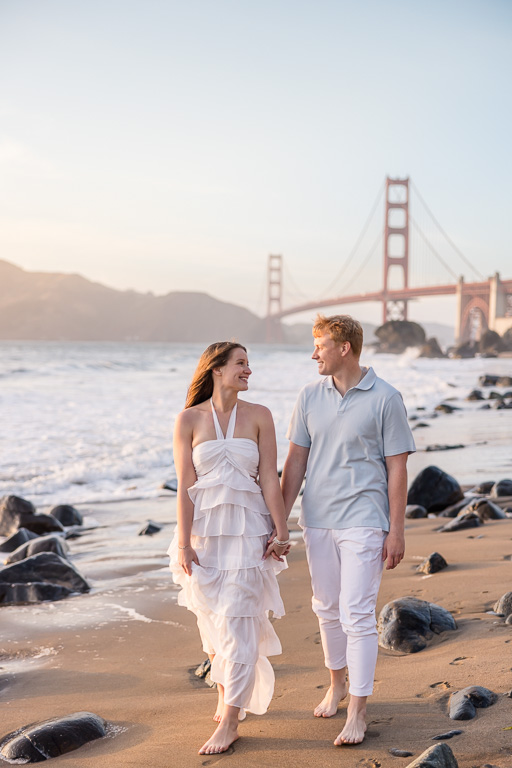 beach engagement photos with white dress