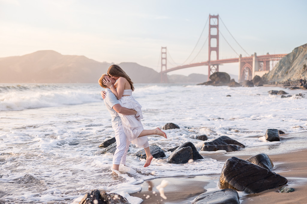 adventurous, candid, fun golden hour engagement session in the ocean water at Marshall’s Beach