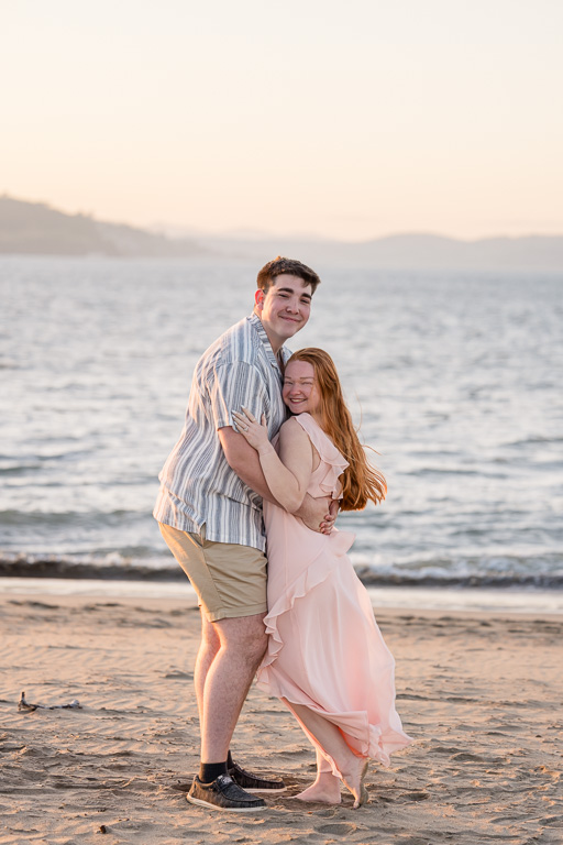 tourist couple on the beach in San Francisco