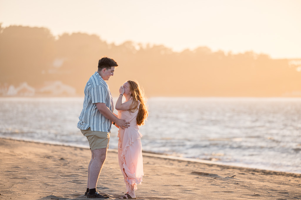 surprise marriage proposal at golden hour on the beach