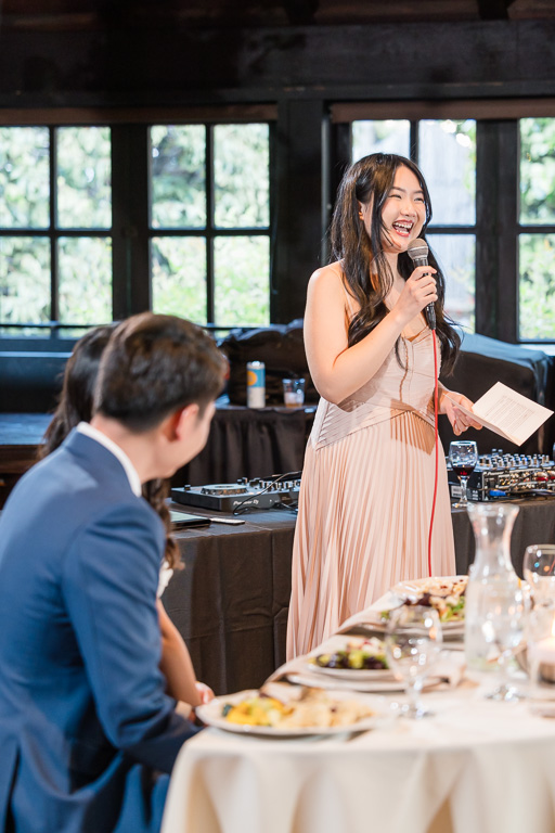 bridesmaid giving a fun speech during Outdoor Art Club reception
